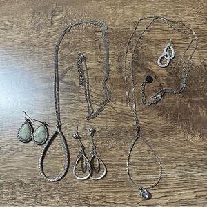 2 long silver necklaces and 3 pair earrings